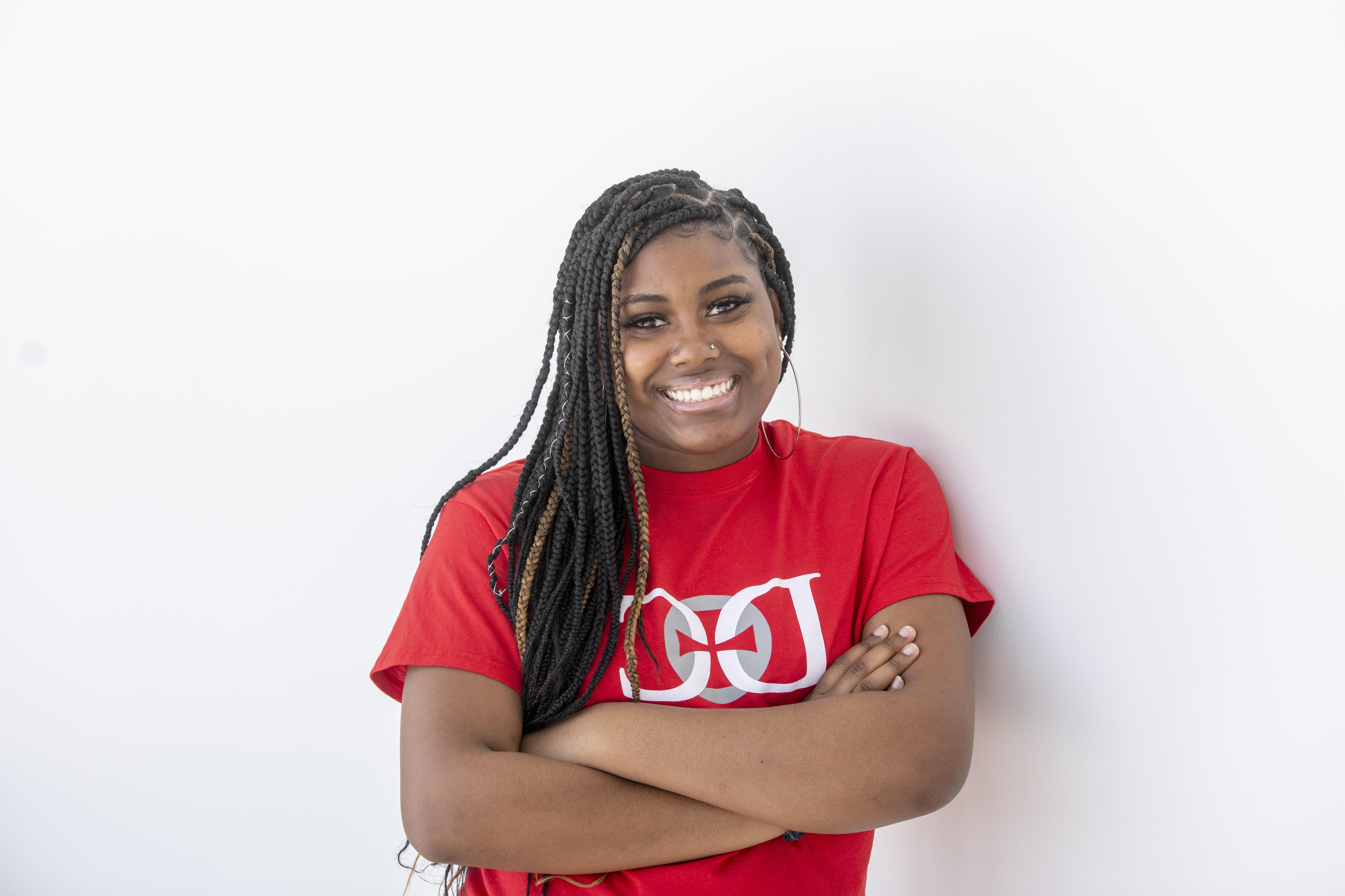 Student smiling in a hallway at Donnelly College.